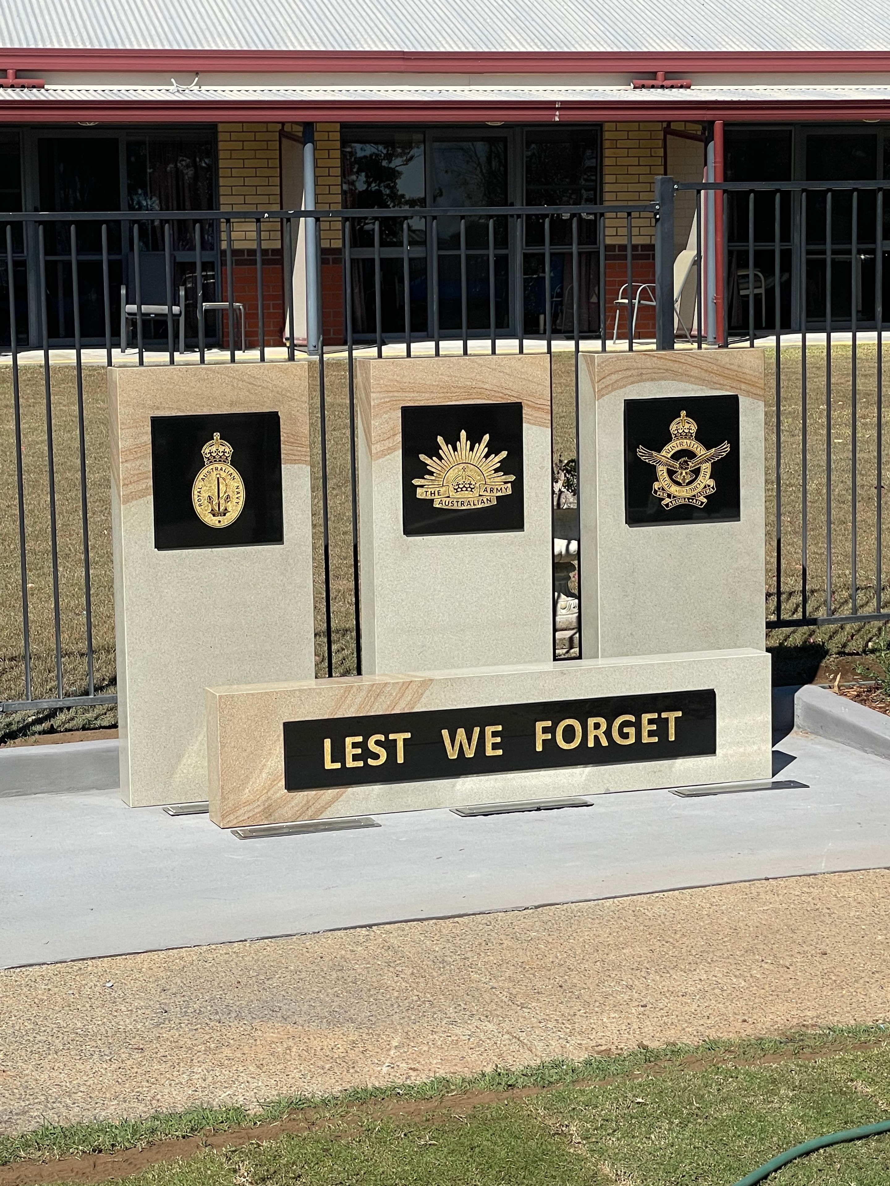 Lest We Forget military emblem memorial display