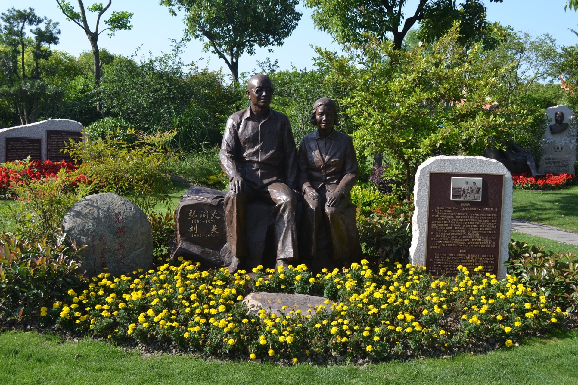 Bronze couple memorial statues in garden